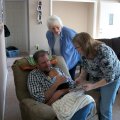 Bob holding Jacskon, Kim and Joy