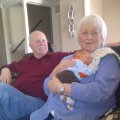 Joy holding Jackson, Tom