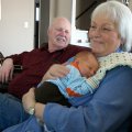 Joy holding Jackson 2, Tom